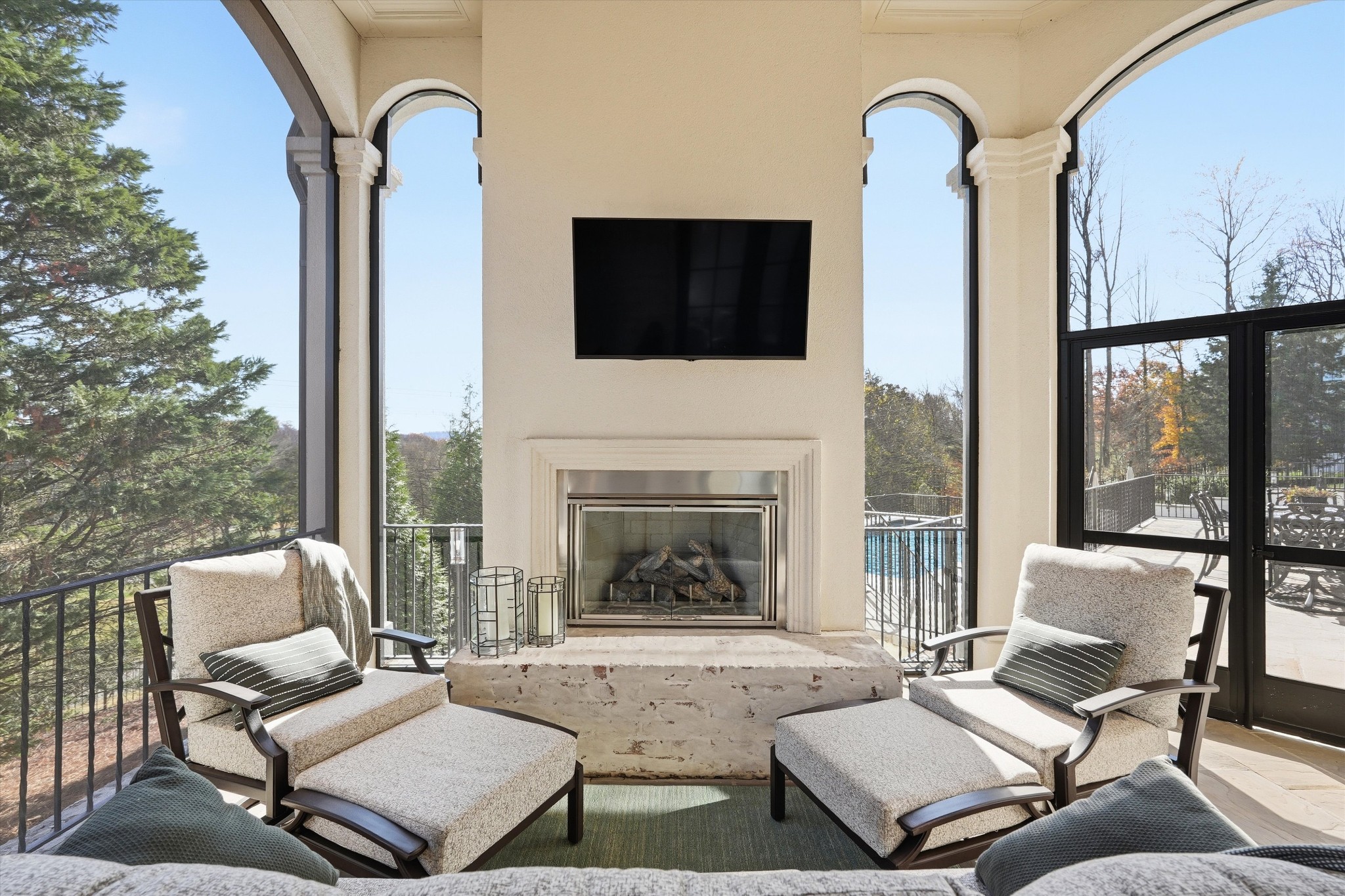 10 Colonel Winstead Drive Brentwood, TN 37027 - Photo 70 of 97 a living room with furniture a fireplace and a flat screen tv