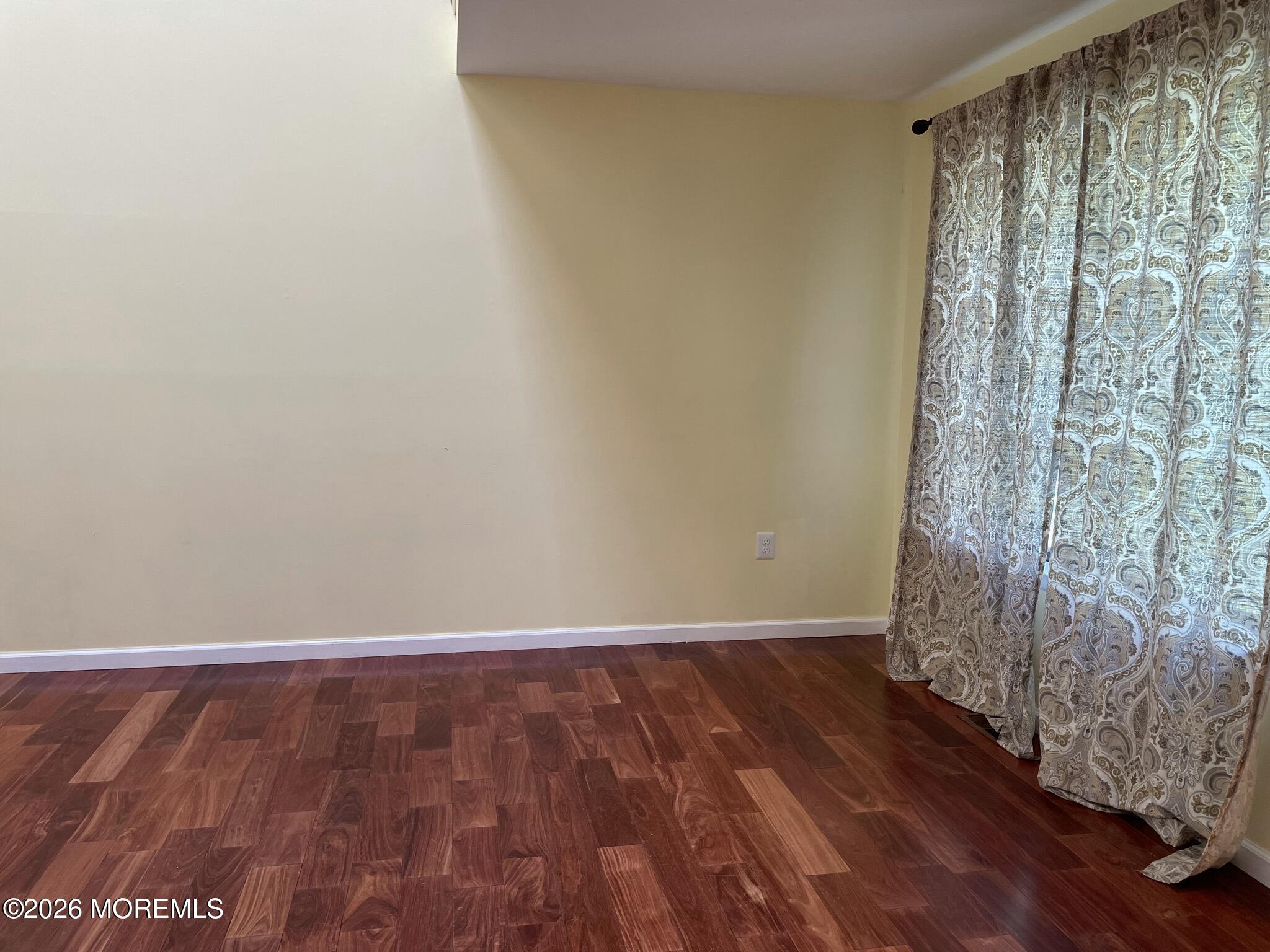19 Clavendon Court Middletown, NJ 07748 - Photo 5 of 21 a view of a room with wooden floor and a window