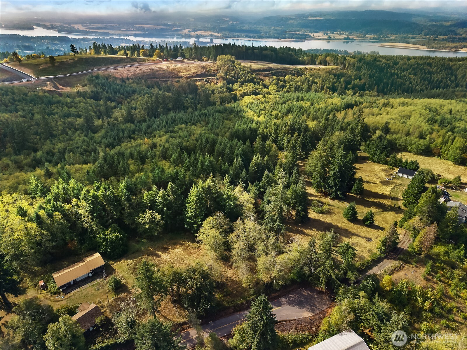 0 Rogers Road, Unit 2 Kalama, WA 98625 - Photo 8 of 9 an aerial view of residential houses with outdoor space and river