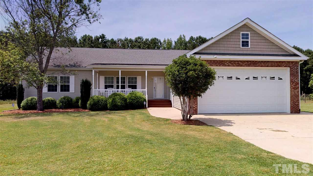 1920 Sanders Road Willow Spring, NC 27592 - Photo 1 of 29 a front view of a house with yard