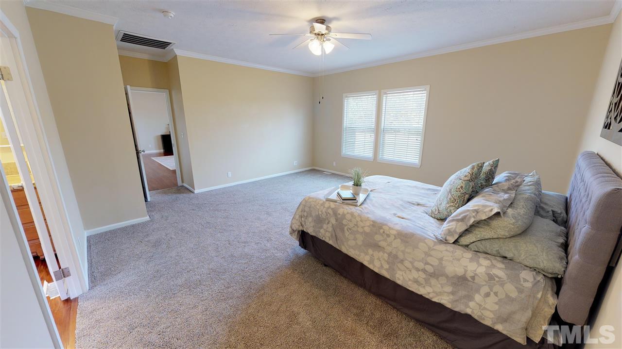 1920 Sanders Road Willow Spring, NC 27592 - Photo 14 of 29 a living room with furniture and a window