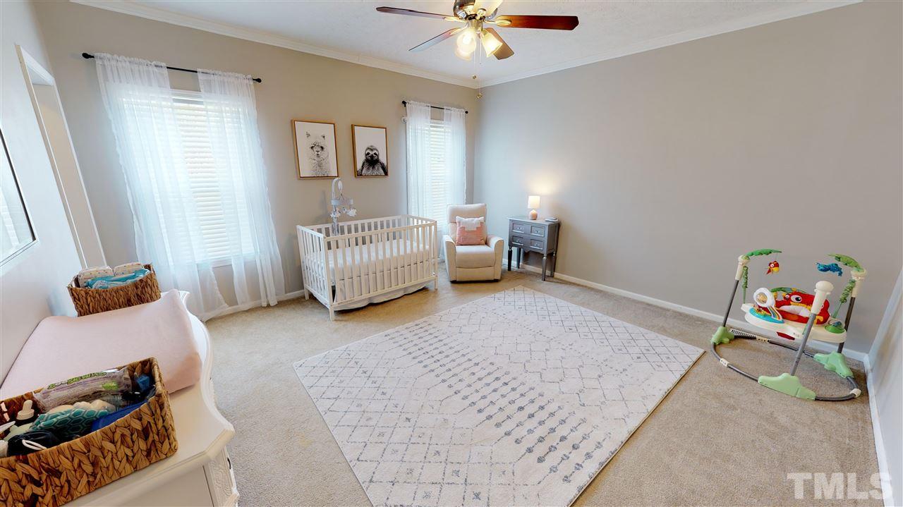 1920 Sanders Road Willow Spring, NC 27592 - Photo 20 of 29 a living room with furniture and a rug