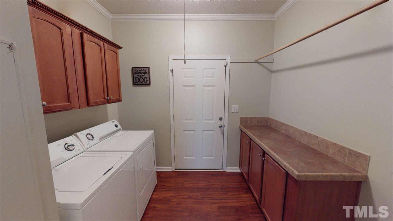 1920 Sanders Road Willow Spring, NC 27592 - Photo 22 of 29 a utility room with dryer and washer