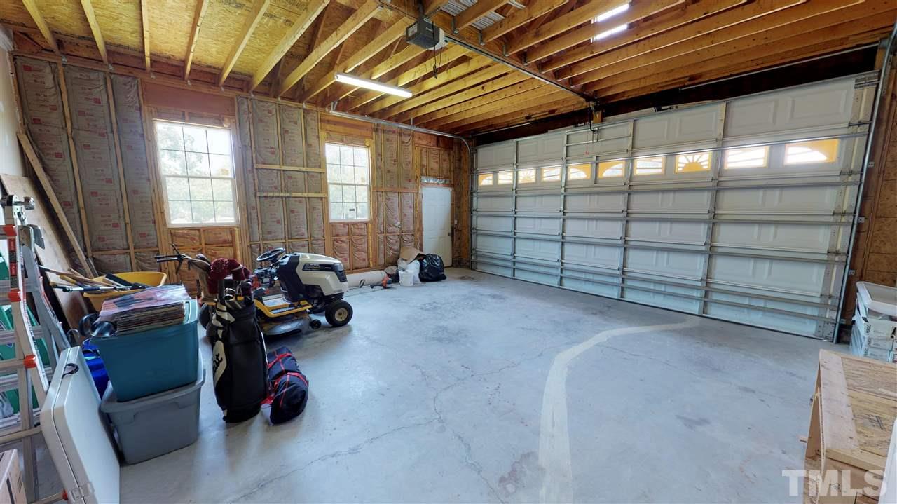 1920 Sanders Road Willow Spring, NC 27592 - Photo 23 of 29 a view of a room with gym equipment