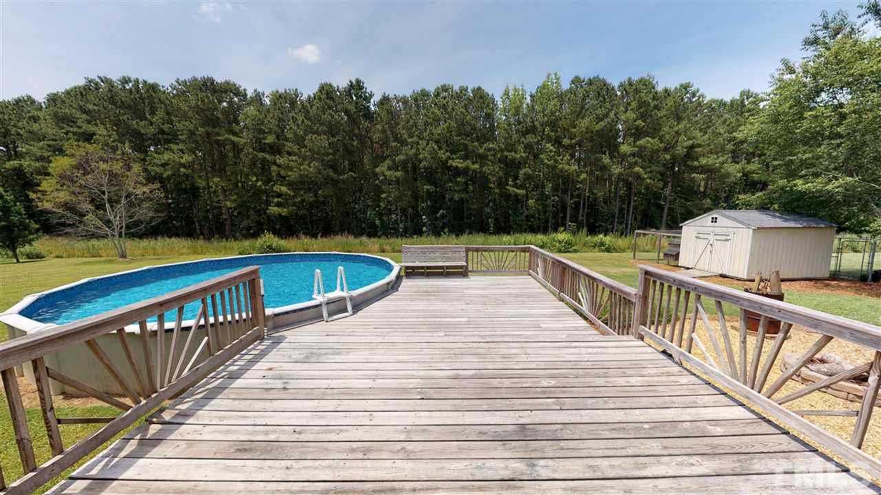1920 Sanders Road Willow Spring, NC 27592 - Photo 24 of 29 a view of balcony with wooden floor and fence