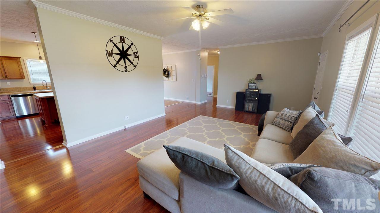 1920 Sanders Road Willow Spring, NC 27592 - Photo 7 of 29 a living room with furniture and wooden floor