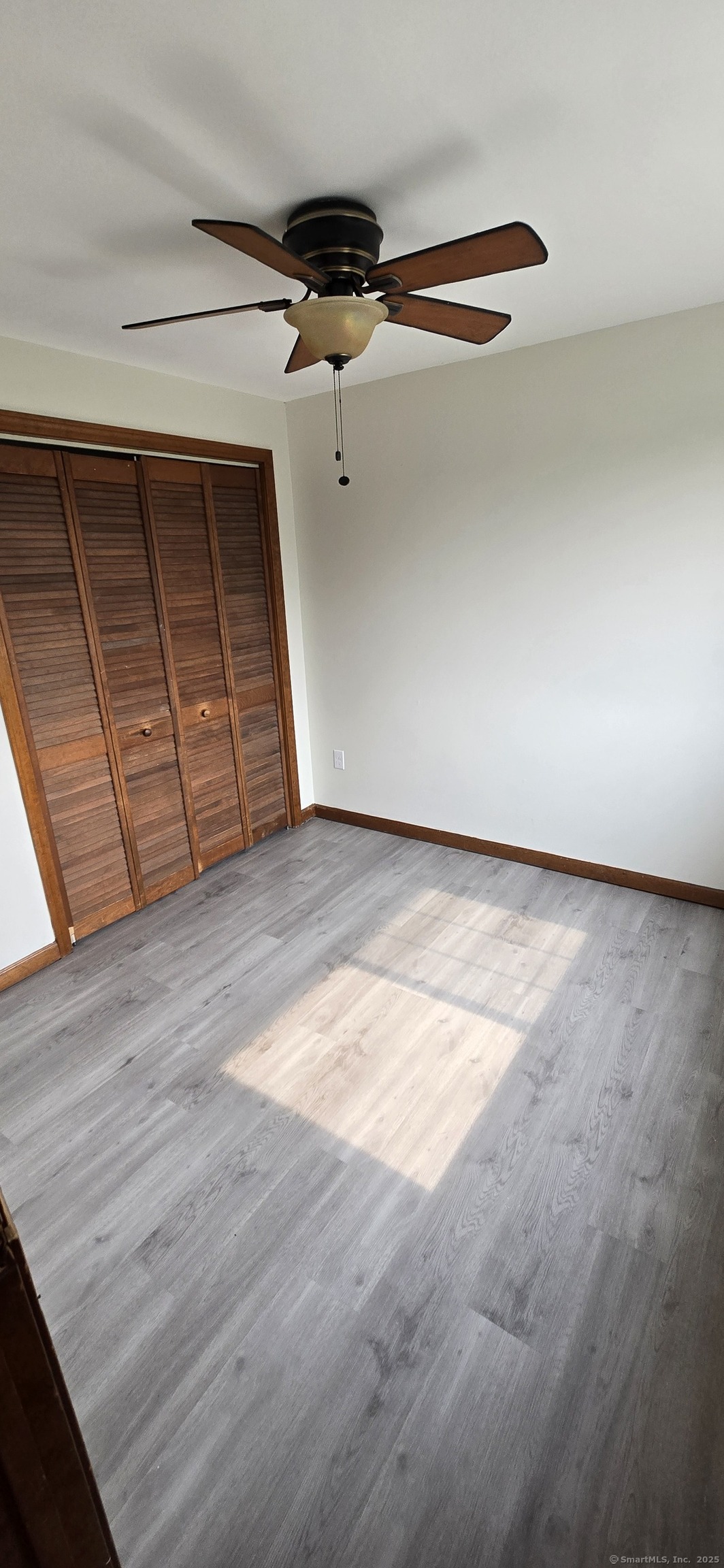 106 Wakelee Road, Unit 1 Waterbury, CT 06705 - Photo 12 of 19 a view of a room with wooden floor
