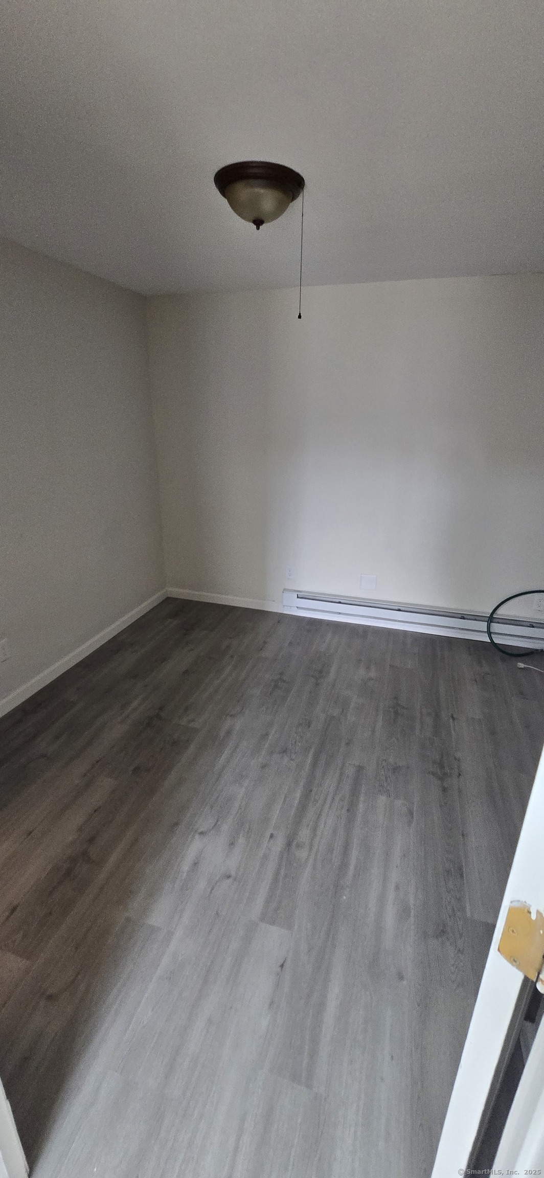 106 Wakelee Road, Unit 1 Waterbury, CT 06705 - Photo 18 of 19 a view of a room with wooden floor