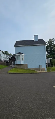 a aerial view of a house with a yard