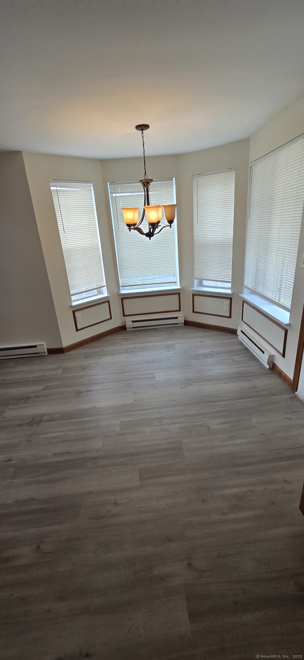 106 Wakelee Road, Unit 1 Waterbury, CT 06705 - Photo 6 of 19 a view of room with window and wooden floor