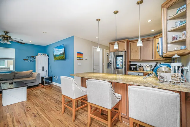 a large kitchen with a table and chairs