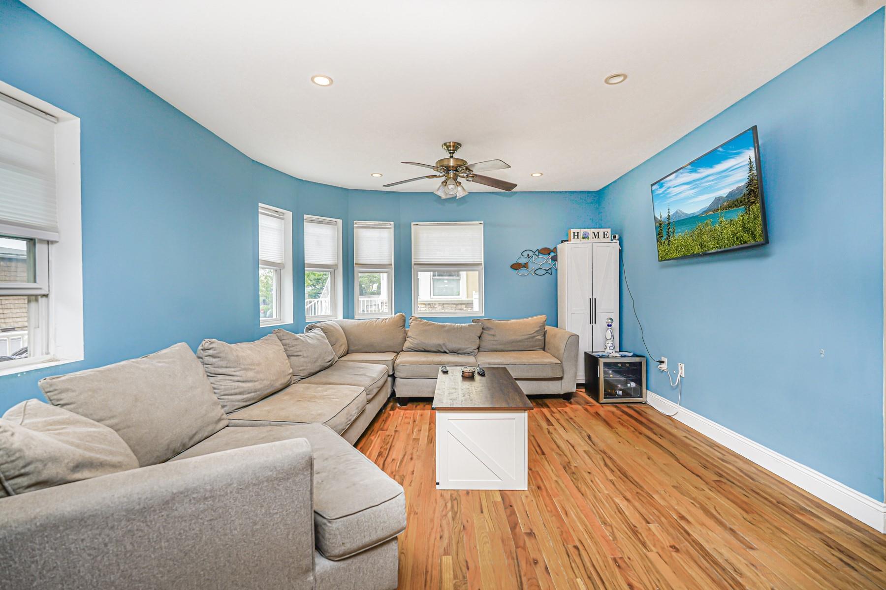 175 Beach 100th Street, Unit 8A Queens, NY 11694 - Photo 9 of 24 a living room with furniture and a large window