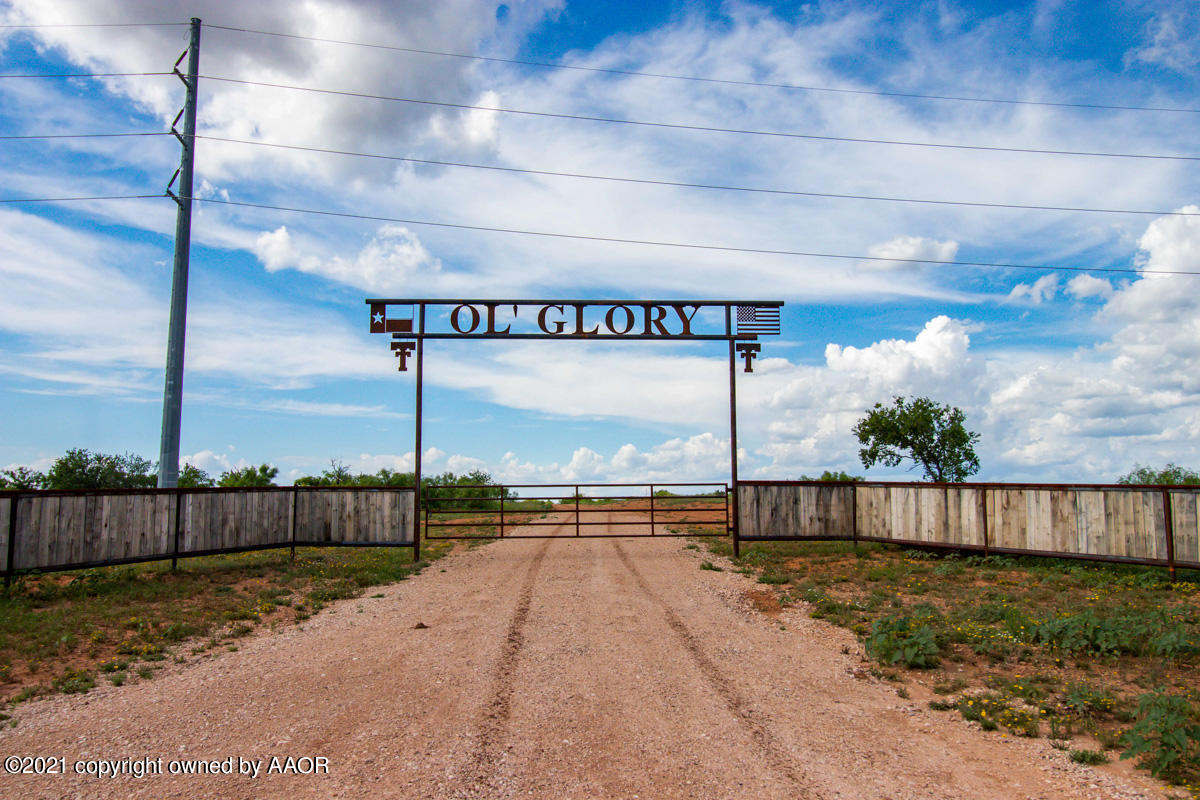 Ol' Glory Ranch Matador, TX 79244 - Photo 2 of 59 a view of a pathway with a wooden fence