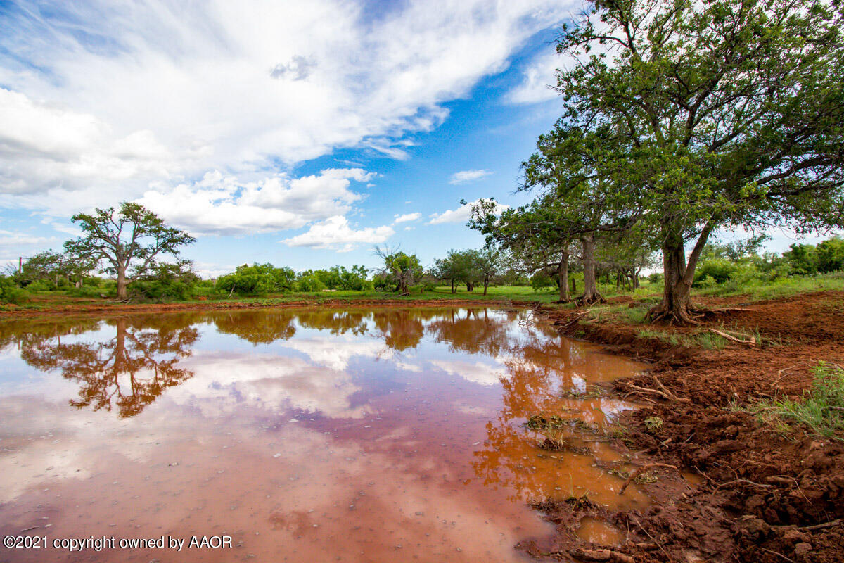 Ol' Glory Ranch Matador, TX 79244 - Photo 6 of 59 a view of a lake with houses in the back