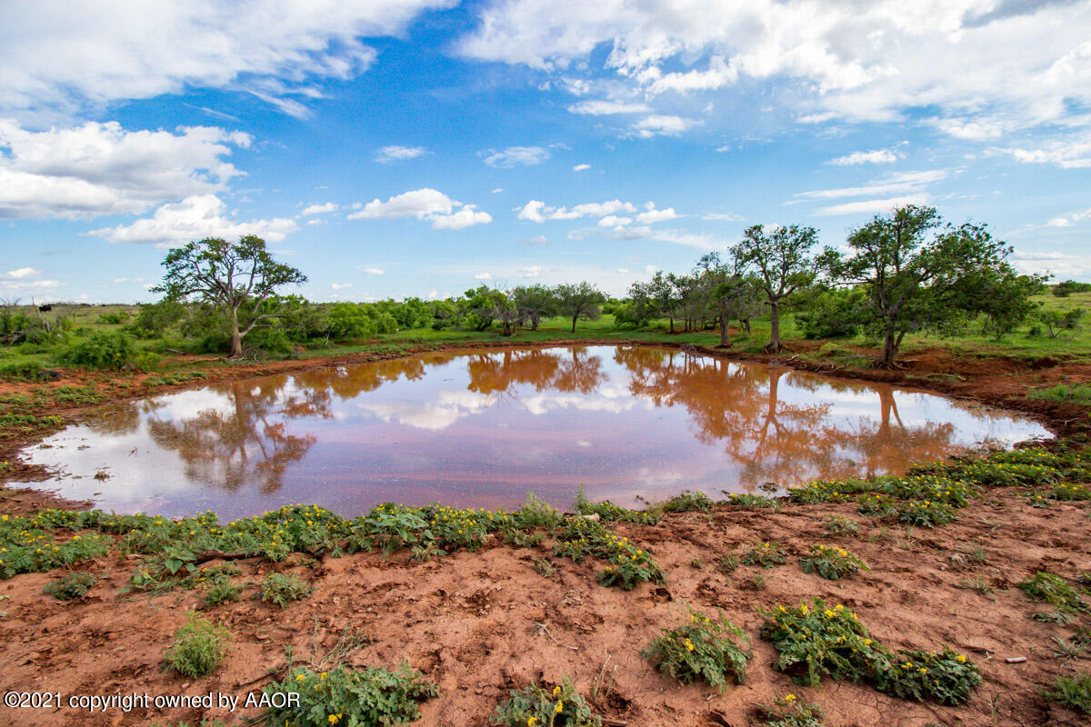 Ol' Glory Ranch Matador, TX 79244 - Photo 10 of 59 a view of a lake with houses in the back
