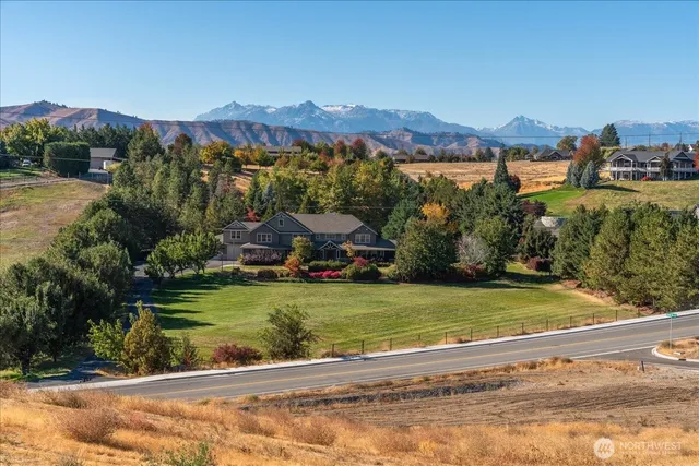 a view of a town with mountains in the background