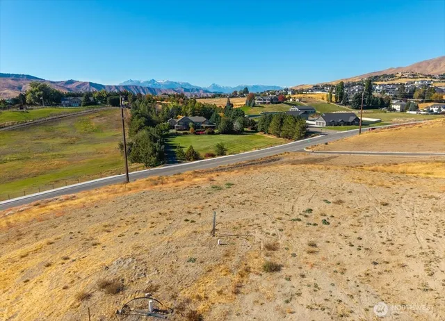 a view of an ocean beach and mountain