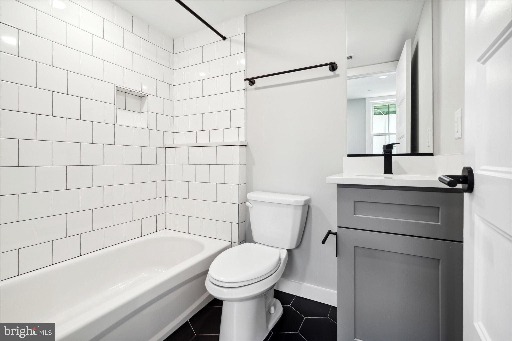 3519 Hamilton Street, Unit 3 Philadelphia, PA 19104 - Photo 15 of 16 a bathroom with a toilet a sink and bathtub