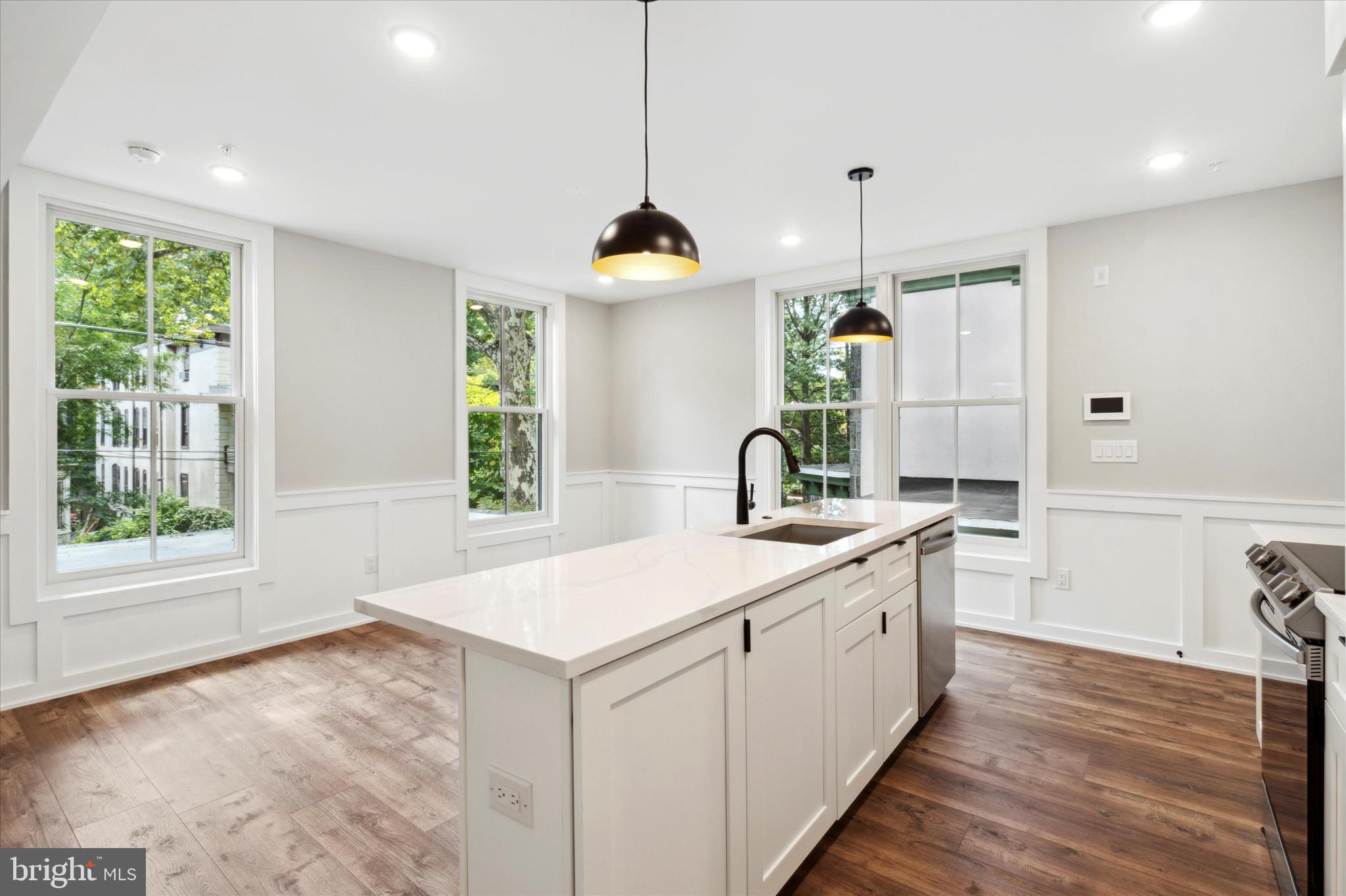 3519 Hamilton Street, Unit 3 Philadelphia, PA 19104 - Photo 6 of 16 a kitchen with a sink and a stove
