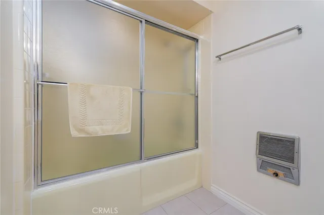 a bedroom with a bed and a table in it