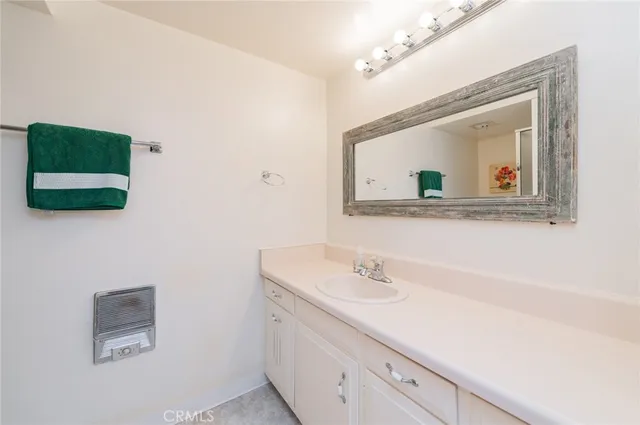a white toilet sitting next to a bathroom sink