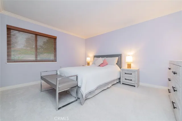 a bathroom with a granite countertop sink mirror and a toilet