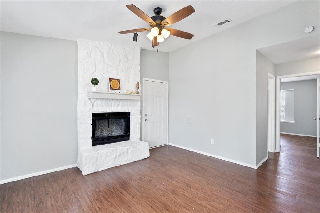 1711 Rawhide Loop Round Rock, TX 78681 - Photo 1 of 14 a view of a livingroom with a fireplace and a ceiling fan