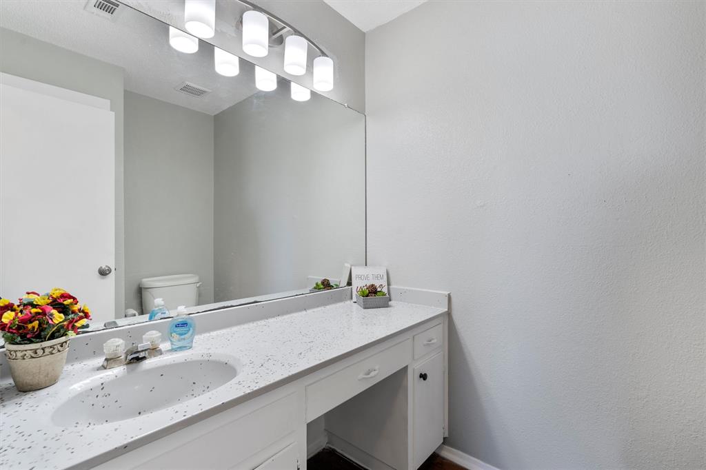 1711 Rawhide Loop Round Rock, TX 78681 - Photo 8 of 14 a bathroom with a sink and a mirror