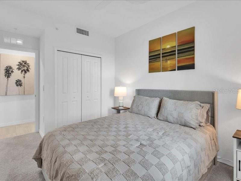19116 Scallop Loop, Unit 303 Lakewood Ranch, FL 34211 - Photo 26 of 32 a large bed sitting in a bedroom next to a lamp
