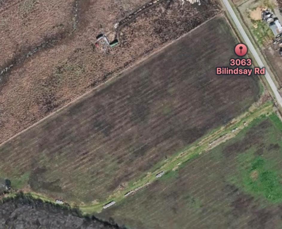 a view of a street with trees in the background