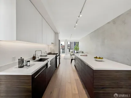 a kitchen with counter space a sink and appliances