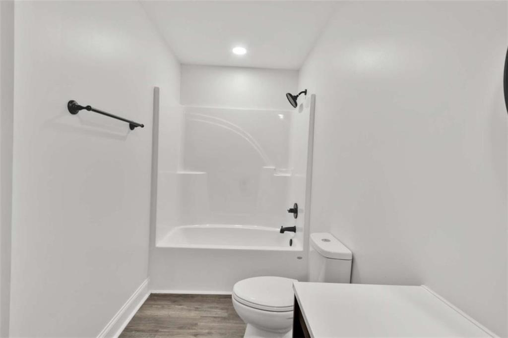 612 Elberta Street Fort Valley, GA 31030 - Photo 13 of 31 a bathroom with a toilet and shower