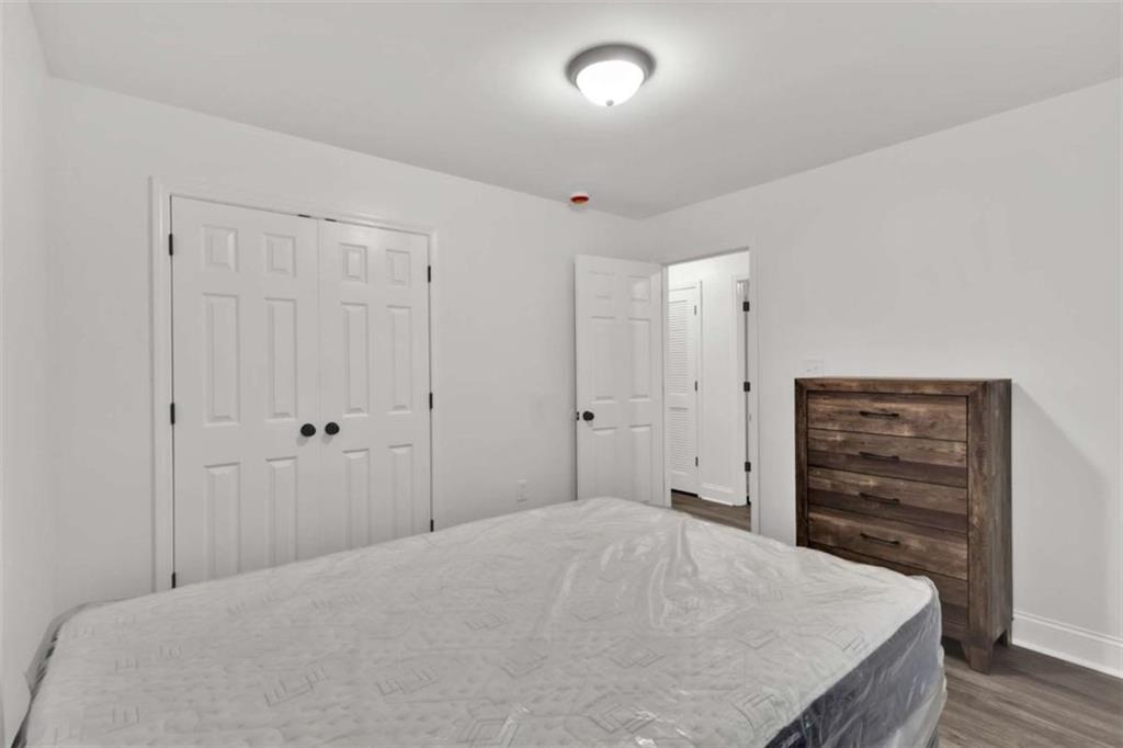 612 Elberta Street Fort Valley, GA 31030 - Photo 16 of 31 a bedroom with a bed and a closet