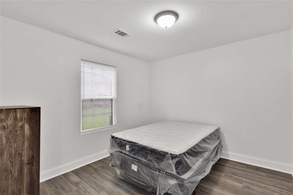 612 Elberta Street Fort Valley, GA 31030 - Photo 17 of 31 an room with a bed and a window