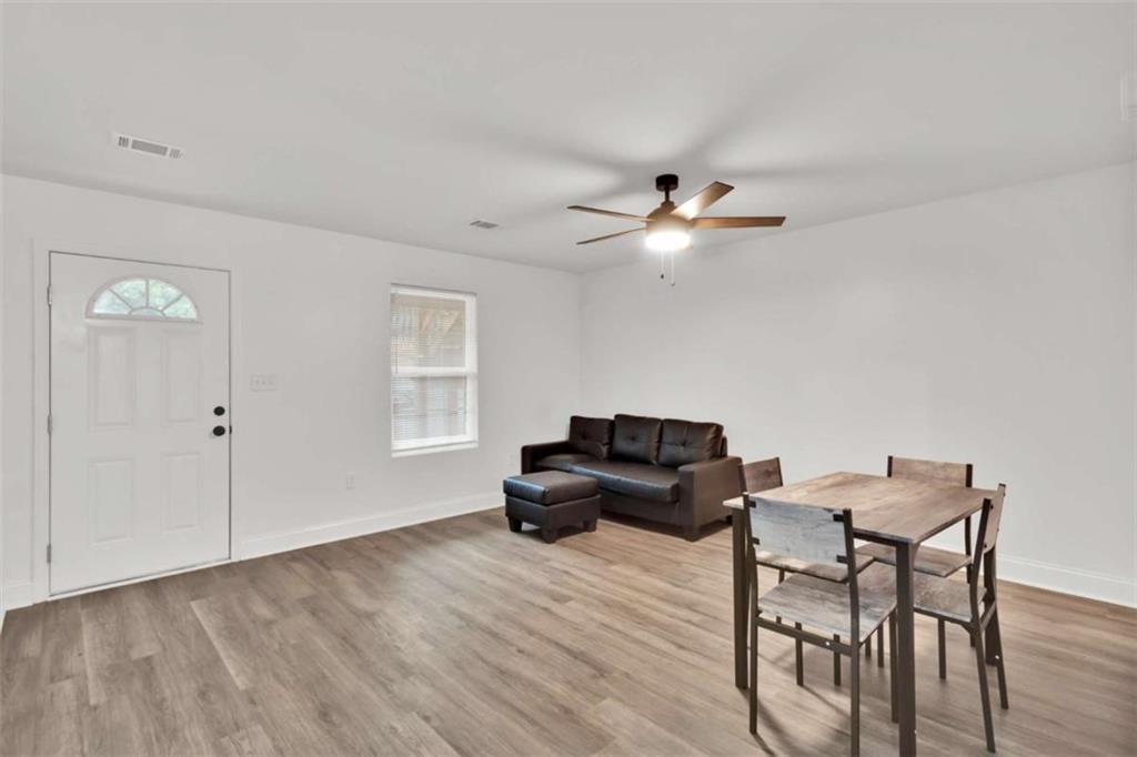 612 Elberta Street Fort Valley, GA 31030 - Photo 23 of 31 a living room with furniture and a ceiling fan