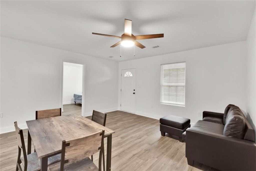 612 Elberta Street Fort Valley, GA 31030 - Photo 25 of 31 a living room with furniture and a window