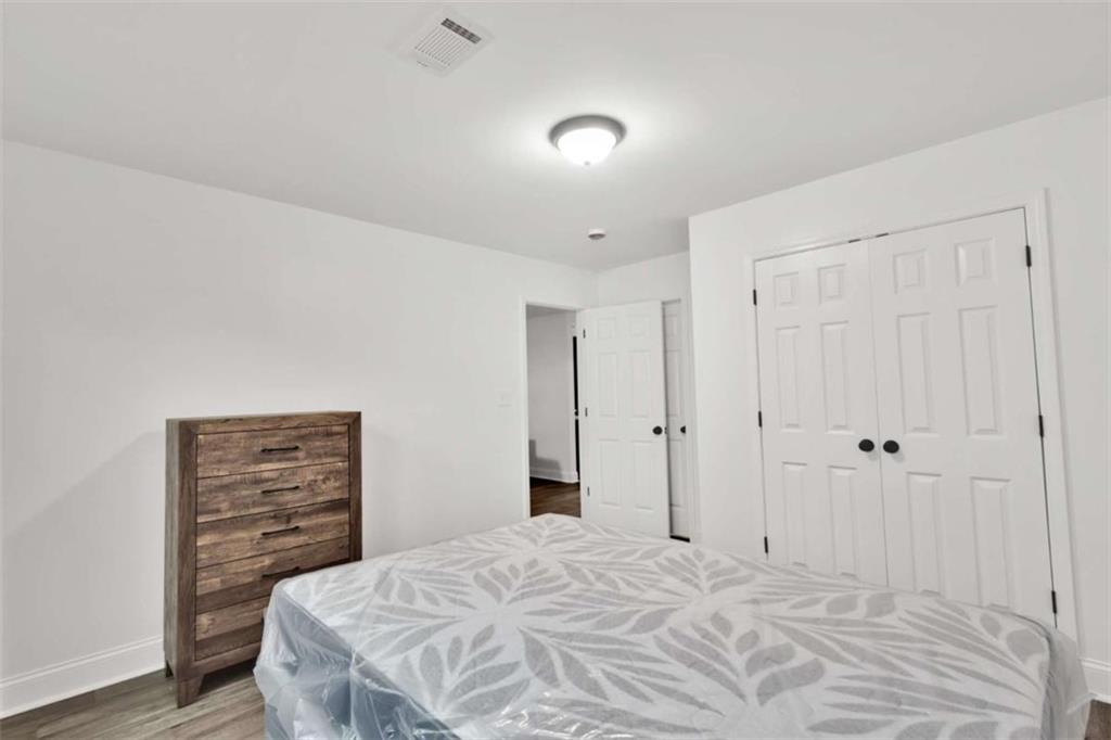 612 Elberta Street Fort Valley, GA 31030 - Photo 28 of 31 a bedroom with a bed and a closet