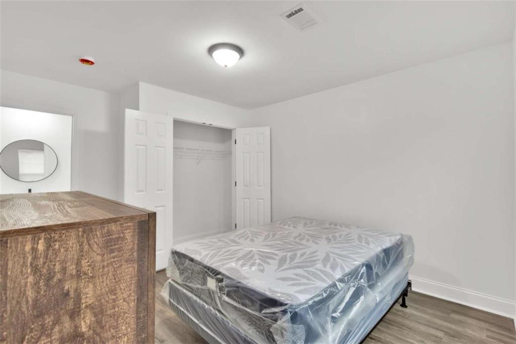 612 Elberta Street Fort Valley, GA 31030 - Photo 30 of 31 a living room with a stove and a table
