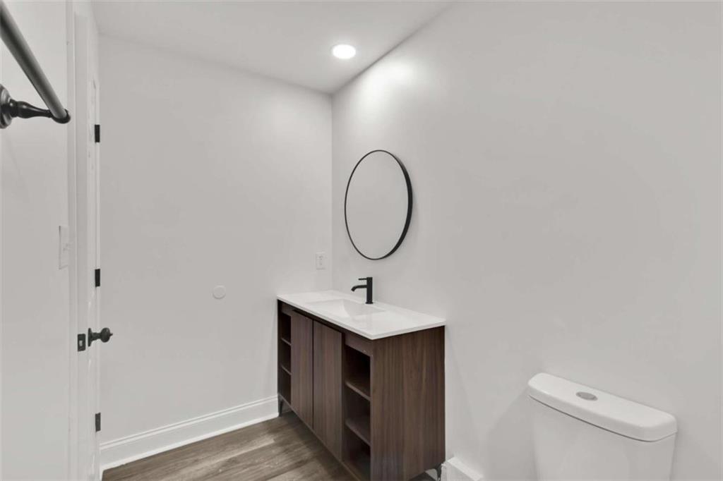 612 Elberta Street Fort Valley, GA 31030 - Photo 31 of 31 a bathroom with a sink vanity and toilet