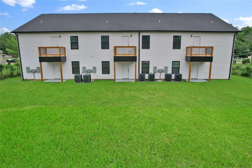 612 Elberta Street Fort Valley, GA 31030 - Photo 4 of 31 a front view of house with yard and barbeque oven