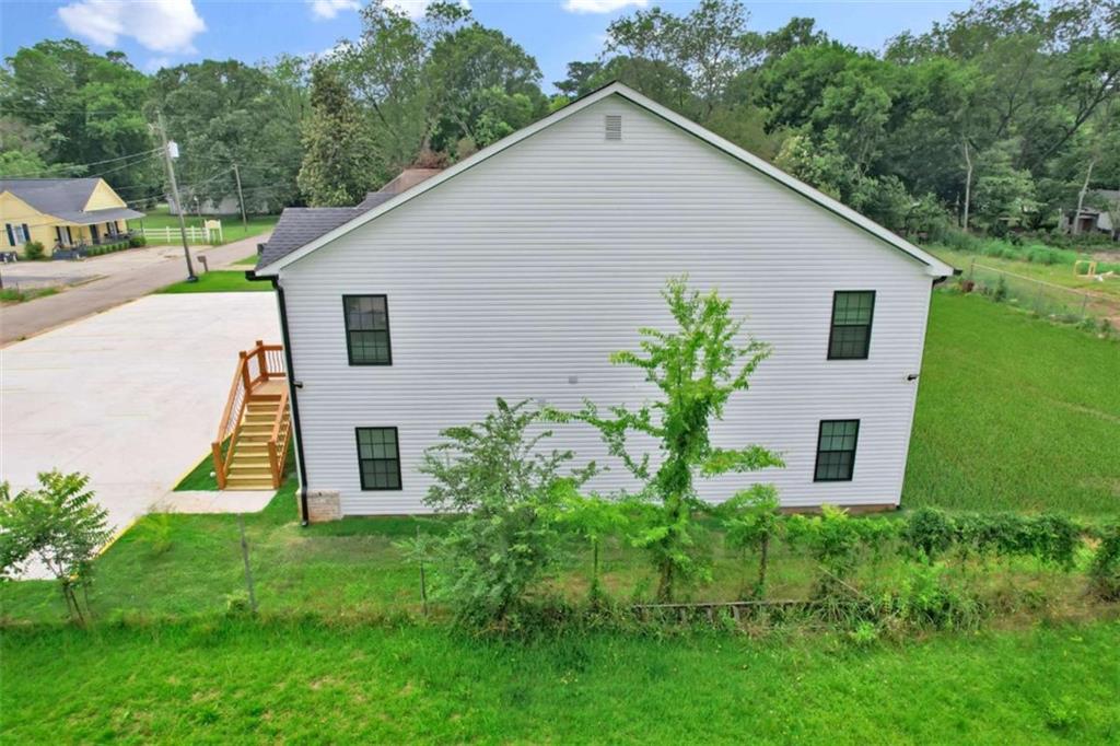 612 Elberta Street Fort Valley, GA 31030 - Photo 6 of 31 a house that has a tree in front of it