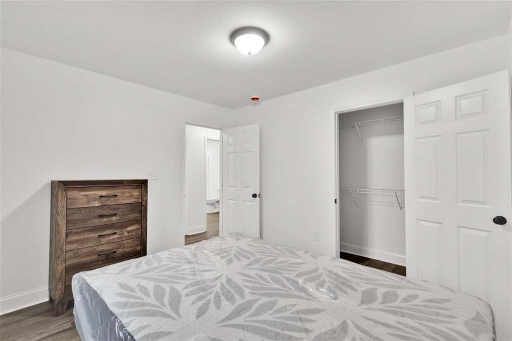 612 Elberta Street Fort Valley, GA 31030 - Photo 10 of 31 a bedroom with a bed and a dresser