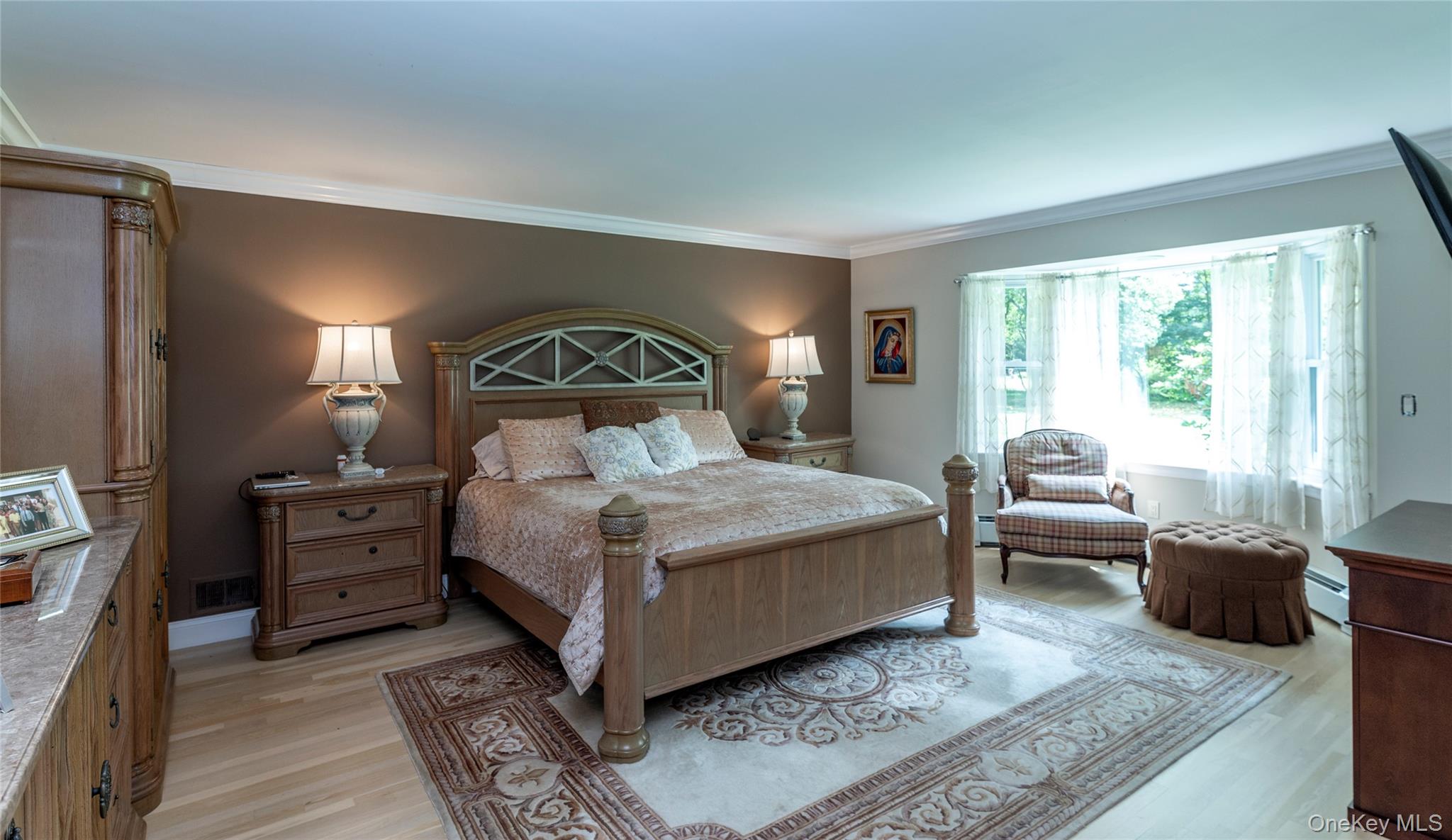 369 Phillips Hill Road New City, NY 10956 - Photo 22 of 40 Bedroom featuring crown molding, light wood-style flooring, and baseboard heating