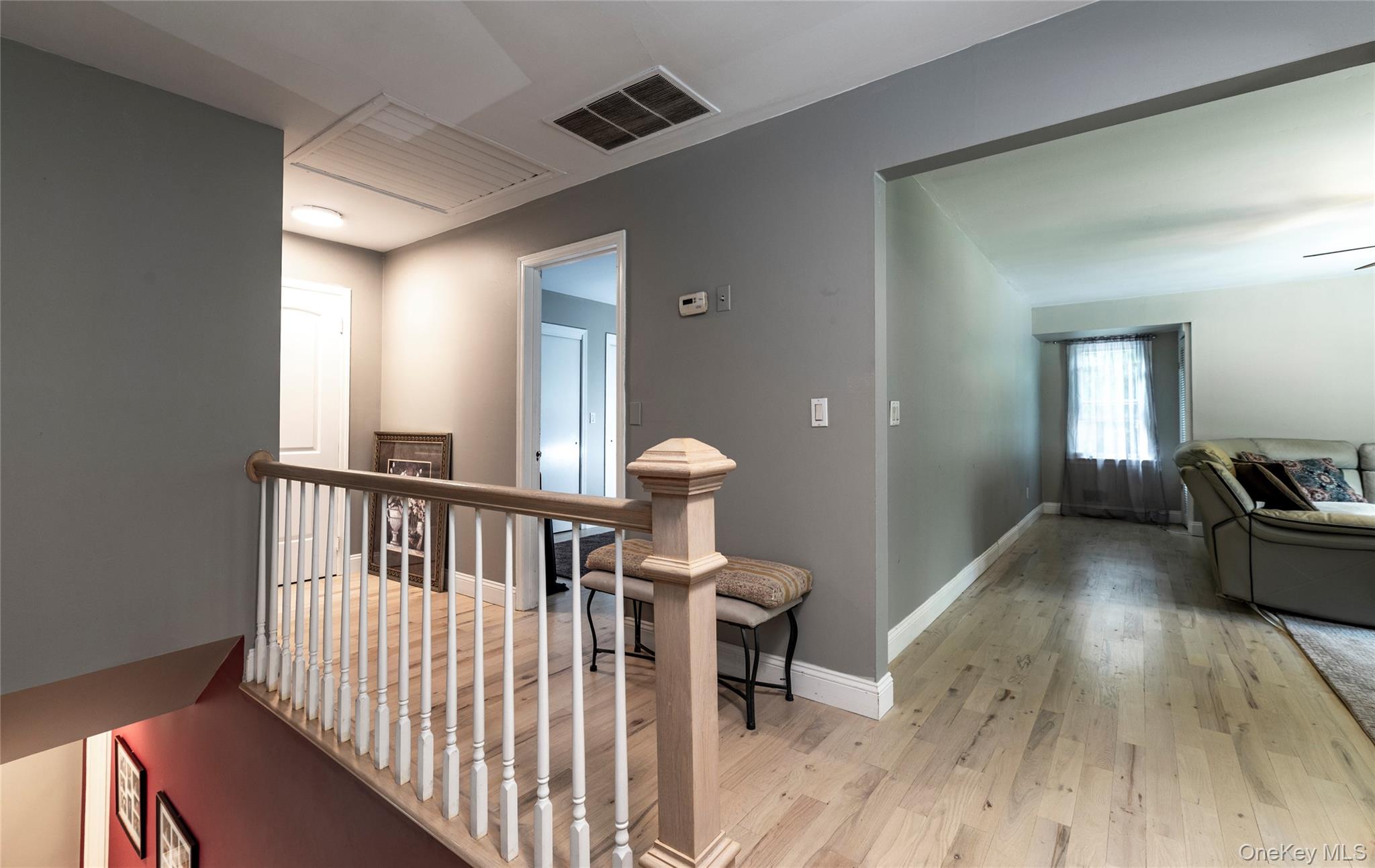 369 Phillips Hill Road New City, NY 10956 - Photo 29 of 40 Hall with light wood-style floors and an upstairs landing