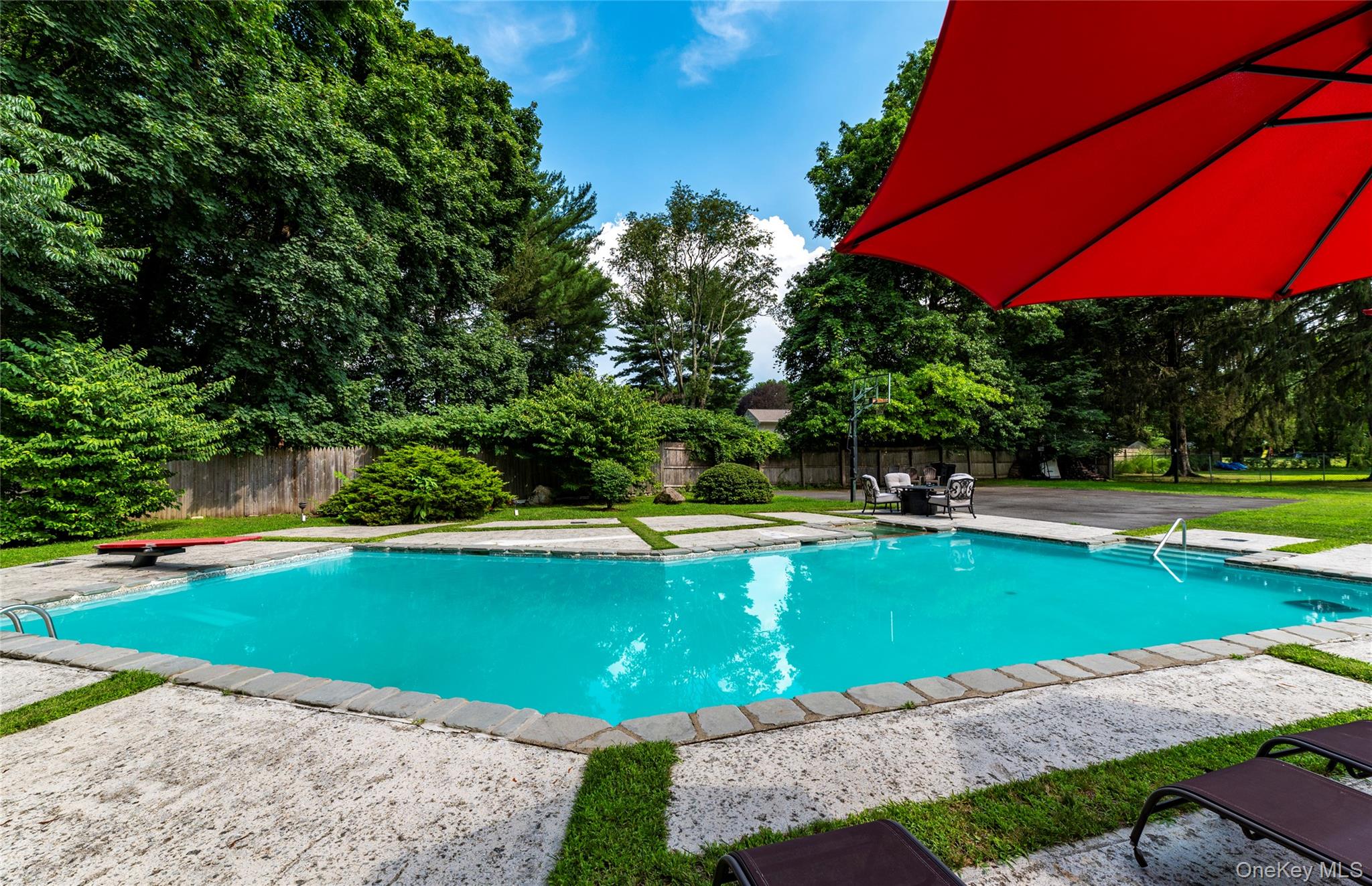 369 Phillips Hill Road New City, NY 10956 - Photo 4 of 40 View of swimming pool featuring a fenced backyard, a diving board, and a patio area