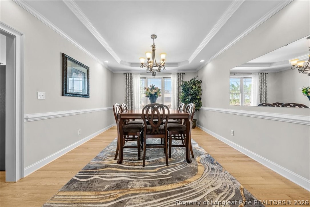 2708 Plum Ridge Road Fayetteville, NC 28306 - Photo 3 of 27 a view of a dining room with furniture and window