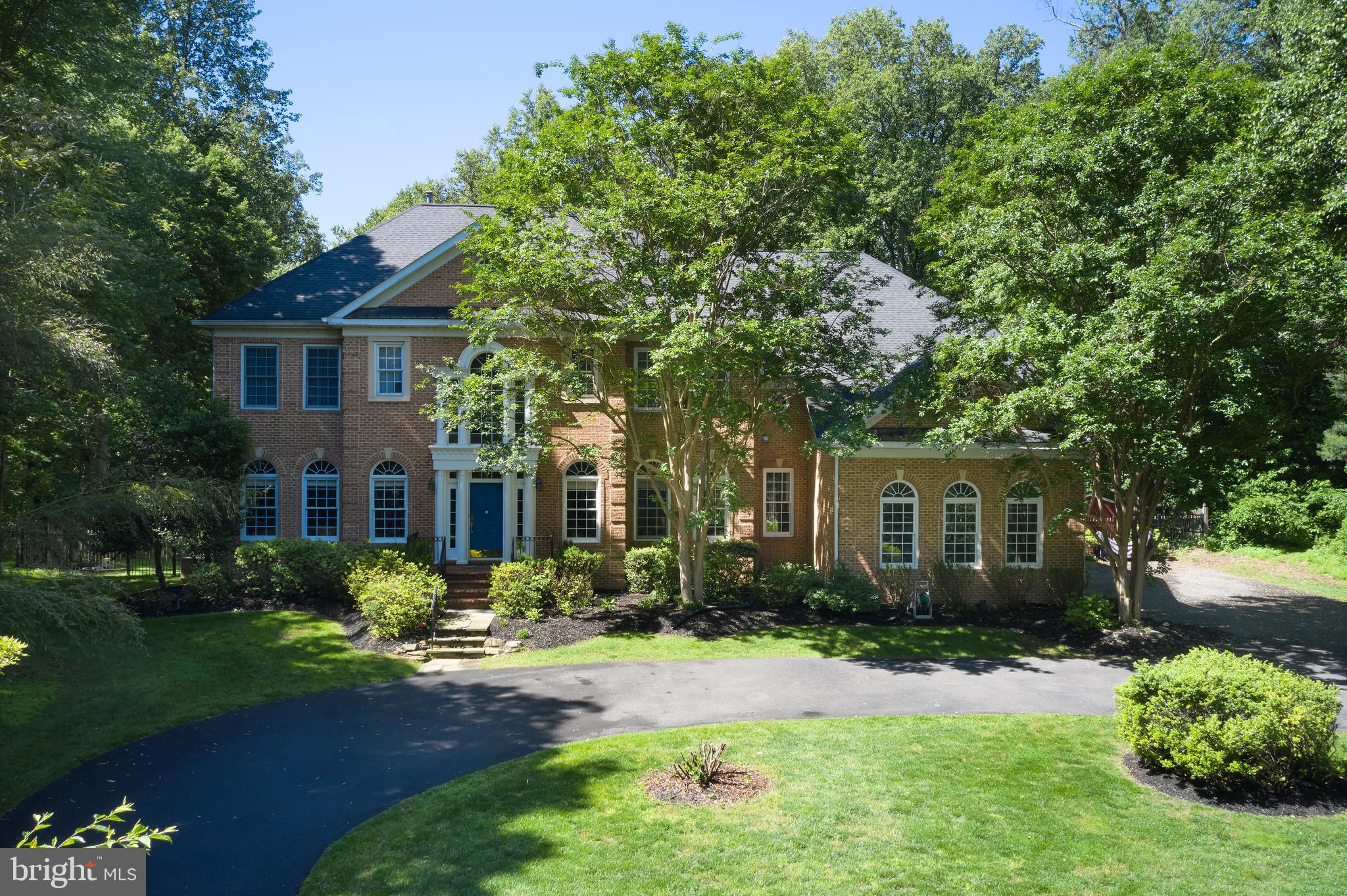 15410 River Road Darnestown, MD 20874 - Photo 54 of 60 a front view of a house with a yard