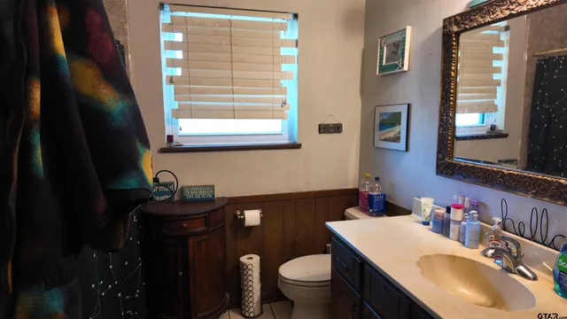 a view of a room that has a couch and a fireplace