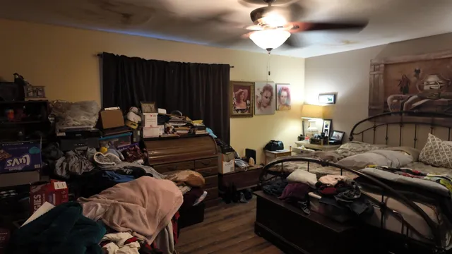 a bedroom with furniture and a closet