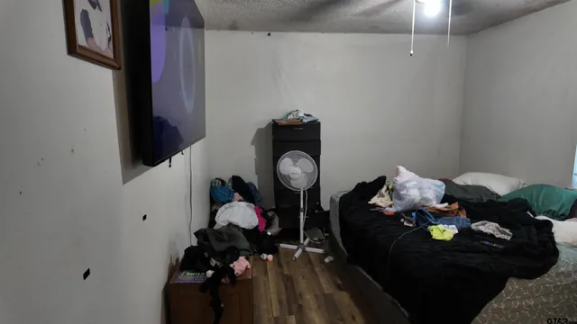 a bathroom with a sink vanity granite and toilet